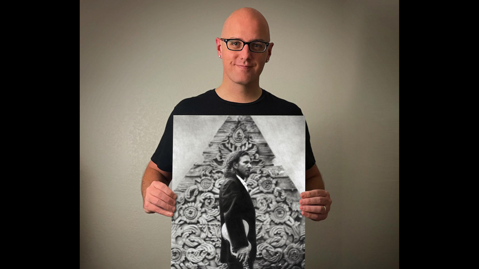 Artist Keegan Hall with the drawing he created of Eddie Vedderpng
