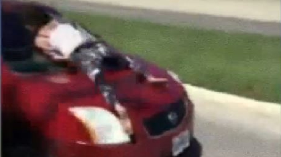 VIDEO Woman jumps on car, run over on NE Side KABB