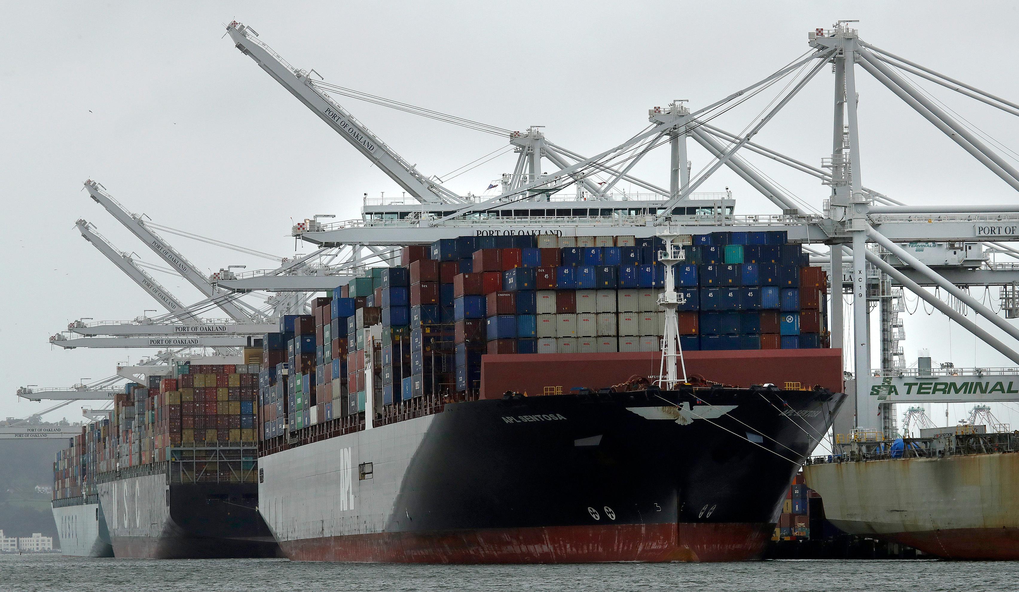 file - in this march 6, 2019, file photo, container ships docked