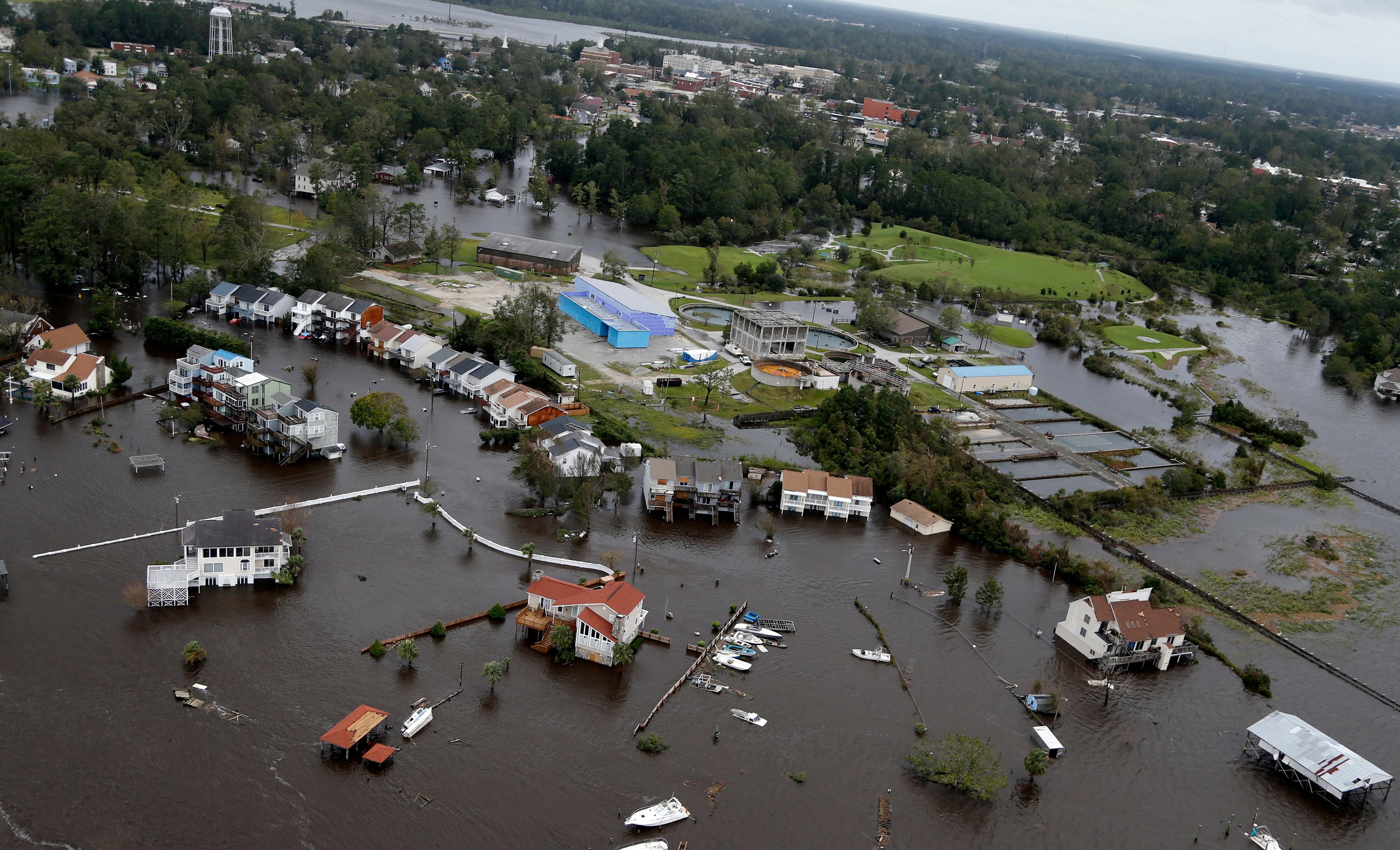 homes and a marina are flooded as a result of high tides and