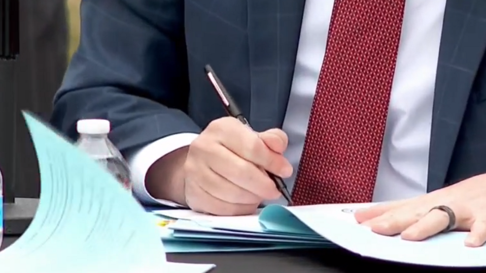 Day after Chauvin verdict, Cox ceremonially signs 12 police reform bills into law - Vimarsana News